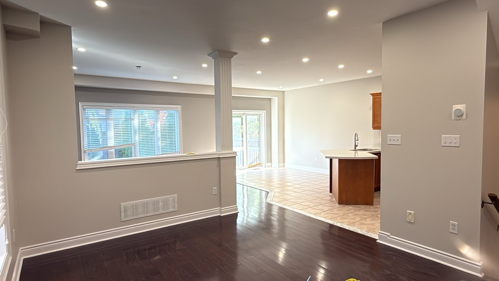 3C Projects completed home renovation — open plan living area with hardwood floors and recessed lighting